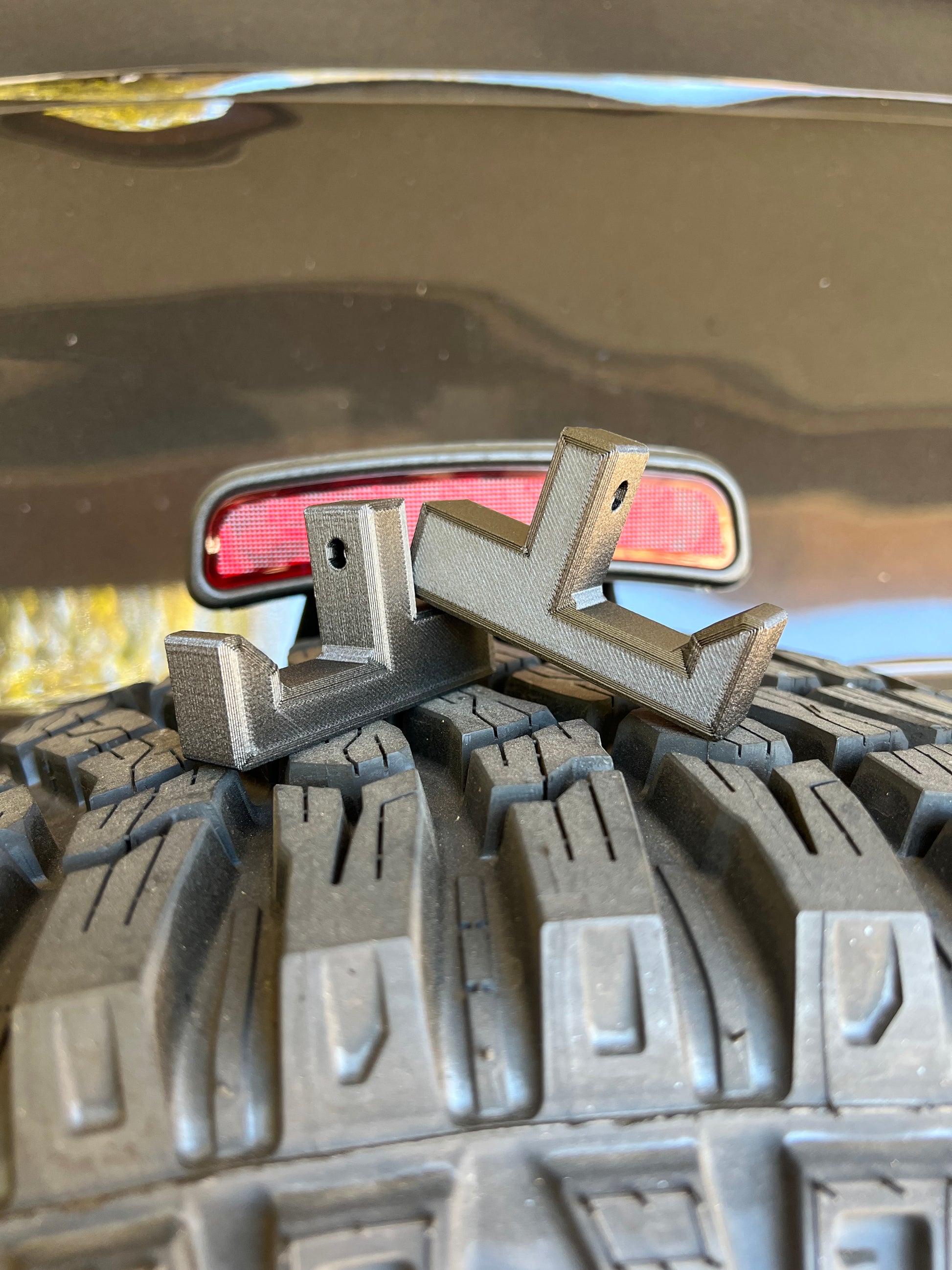 Bronco gear hooks displayed on back tire of Ford Bronco