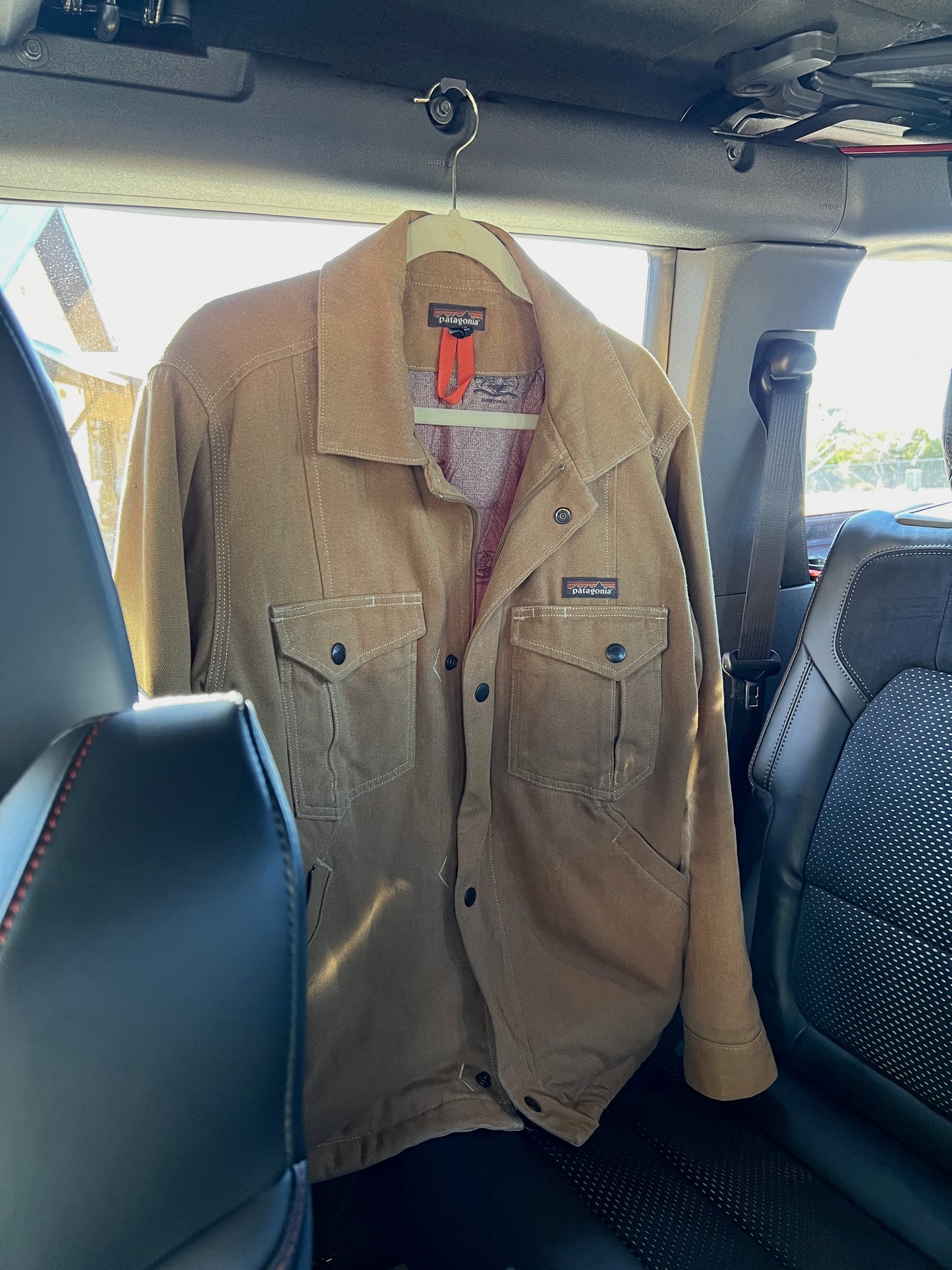 Jacket hanging in back of Ford Bronco 